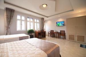 מיטה או מיטות בחדר ב-Bin Bin Hotel 3 - Near SC Vivo City D7