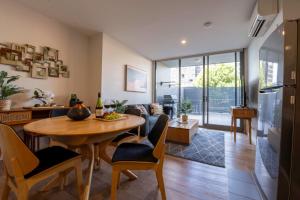 a kitchen and living room with a table and chairs at Eastside apartment in Charlestown