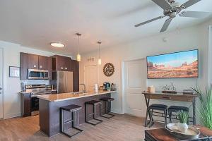 a large kitchen with a large island in a room at Shopping & Dining 1 Mile - 24 Hour Pool with Parking - 4036 in Phoenix