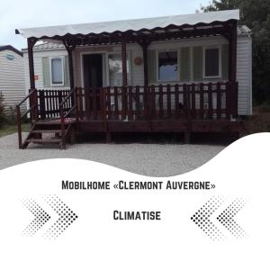 a screened in porch of a manufactured home with a gazebo at Mobilhome Clermont Auvergne Climatisé in Sigean