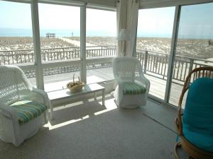 a living room with a view of the beach at Nice Home In Brant Beach With 4 Bedrooms And Internet in Brant Beach