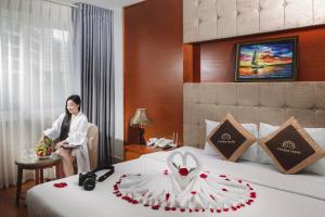 Postel nebo postele na pokoji v ubytování T78 Nha Trang Hotel