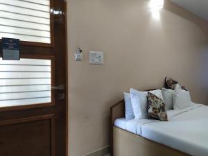 Voodi või voodid majutusasutuse Hotel Angel Assam toas