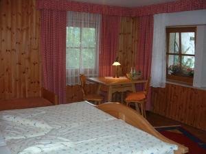 A bed or beds in a room at Weissenbach in the Schenk holiday home