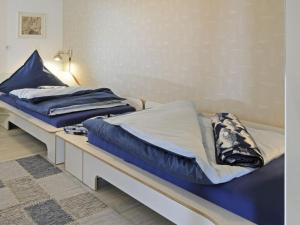 Ένα ή περισσότερα κρεβάτια σε δωμάτιο στο MeerZeit on Juist Comfortable holiday residence