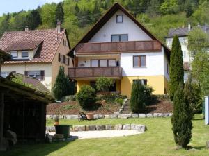a large house with a yard in front of it at Holiday apartment Renate in Rottenburg
