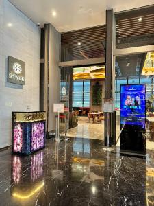 a lobby with a large screen in a building at The Platinum 2 Kuala Lumpur By Collective Haus in Kuala Lumpur