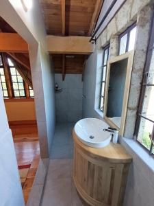 a bathroom with a sink in a room with windows at Amani House in Nairobi