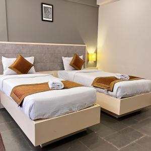 Hotel Dwarawata客房内的一张或多张床位
