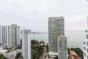 a city with tall buildings and a body of water at Sky Suites in George Town