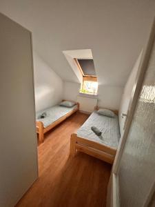 Łóżko lub łóżka w pokoju w obiekcie Apartament Słoneczny 7