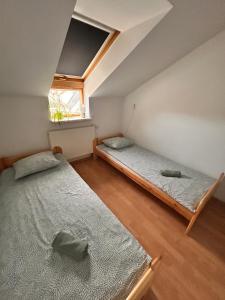 Łóżko lub łóżka w pokoju w obiekcie Apartament Słoneczny 7