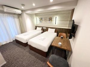 大阪惠比寿酒店客房内的一张或多张床位