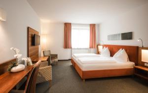 Voodi või voodid majutusasutuse Hotel Clara toas