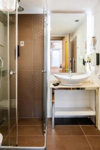 a bathroom with a sink and a shower at Cheya Besiktas Hotel & Suites- Special Category in Istanbul