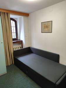 a large bed in a room with a window at Apartament dla dwóch osób - Piotrkowska 262-264 pok A101 in Łódź