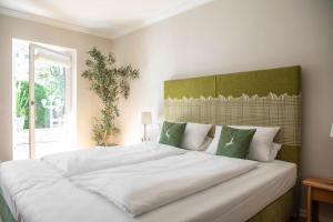 Ένα ή περισσότερα κρεβάτια σε δωμάτιο στο Hotel Bachmair Alpina +68 φωτογραφίες