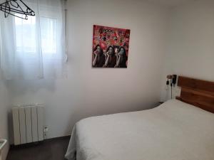 Postel nebo postele na pokoji v ubytování T2 VUE MER accès plage
