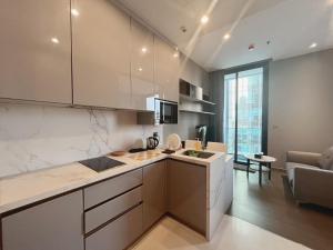 a kitchen with a sink and a counter top at Cozy 1-BR Luxury Getaway in the Heart of Bangkok in Bangkok