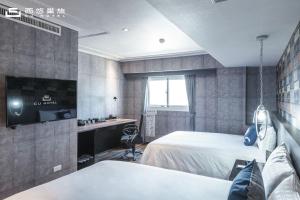 TV a/nebo společenská místnost v ubytování CU Hotel Kaohsiung