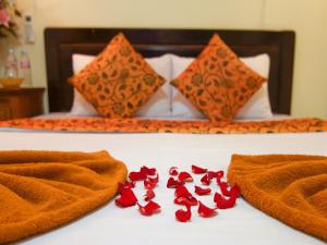 Postel nebo postele na pokoji v ubytování Angkor Mithona Guesthouse
