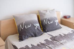 a bed with two pillows with the words new you on them at Angelina - La002 in Cagnes-sur-Mer