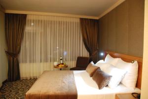 Ένα ή περισσότερα κρεβάτια σε δωμάτιο στο Volley Hotel İzmir