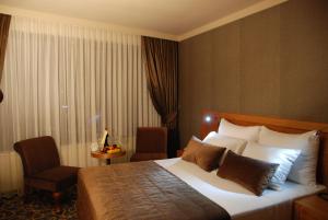 En eller flere senger på et rom på Volley Hotel İzmir