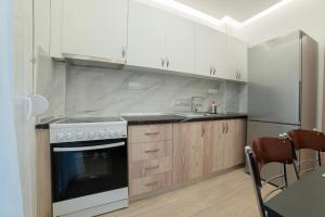 Η κουζίνα ή μικρή κουζίνα στο Spacius and Comfy apartment Thessaloniki