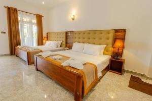 Elysia Sigiriya Hotel客房内的一张或多张床位