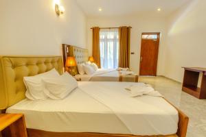 Elysia Sigiriya Hotel客房内的一张或多张床位
