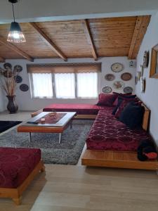 a living room with a couch and a table at The house of dreams in Shkodër