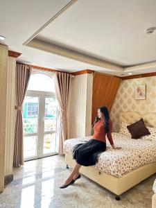 Postel nebo postele na pokoji v ubytování Xing City Hotel Dalat + 35 fotografií