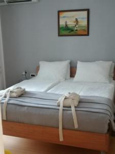 Llit o llits en una habitació de Apartments Villa Martinuzzi