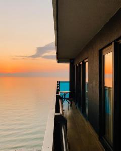 a view of the ocean from a building at Luxury Aparthotel orbi in black sea arena in Batumi