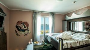 Postel nebo postele na pokoji v ubytování Hotel Butterfly