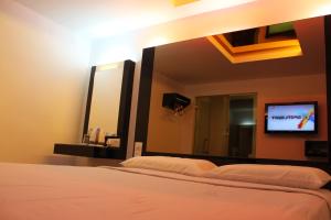 Postel nebo postele na pokoji v ubytování Time Hotel