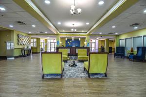 a hospital lobby with chairs and a waiting room at Holiday Inn Express & Suites Cocoa, an IHG Hotel in Cocoa