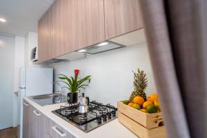 a kitchen with a counter with fruits on it at Club del Sole Viareggio Family Collection in Torre del Lago Puccini