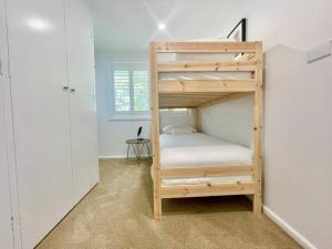 a bedroom with a bunk bed in a room at Henderson House in Wentworth Falls