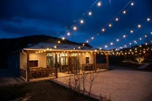 a string of lights over a house at night at EcoLodge in Wildlife Refuge in Urtsʼadzor