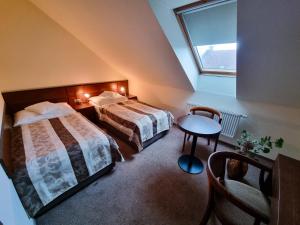 Ліжко або ліжка в номері Hotel Mario