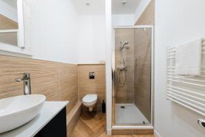 a bathroom with a toilet and a sink and a shower at All in Lyon | T2 design & climatisé – Centre in Lyon