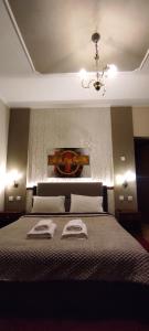 A bed or beds in a room at Erodios Guesthouse