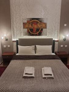 A bed or beds in a room at Erodios Guesthouse