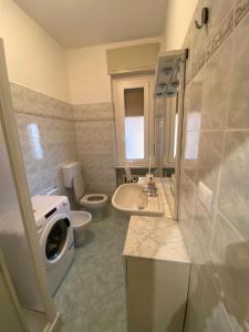 a bathroom with a toilet and a sink at Bella Vista in Canelli +25 photos