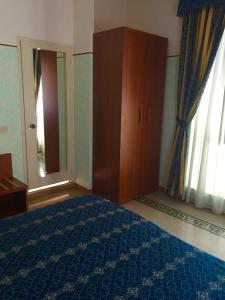 Posteľ alebo postele v izbe v ubytovaní Hotel Miramare