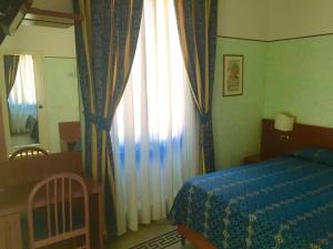 Posteľ alebo postele v izbe v ubytovaní Hotel Miramare