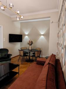a living room with a couch and a table at Caravin Wanderhome Acropolis, 1 min from Acropolis Museum in Athens +110 photos