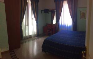 Posteľ alebo postele v izbe v ubytovaní Hotel Miramare